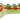Top-down view of the Green Cloud Cali Inc DankStop 3-inch Glass w/ Drips Hand Pipe showing a light green glass body with red swirls and three raised green drip accents on a black background.