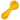 Angled close-up of a yellow DankStop Frit Glass with Rasta Line Spoon Pipe - 4.5 in., showing its rounded bowl and twisted red-striped line running along the handle.