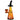 Three-quarter view of the Pulsar Witching Season Glass Bubbler - 6.5" in translucent orange with a black witch-hat mouthpiece and jack-o'-lantern face.