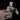 A hand holds the Matrix Ashcatcher, displaying the clear glass construction and its unique, multi-faceted design.