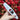 Close-up of a hand holding the Daily High Club x Chong's Choice "Fat Steamroller" white glass pipe with a red-tipped mouthpiece against bright red autumn leaves.