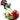 A close-up, angled view of the Ribbit Spoon Pipe, showing a red and green sculpted pipe resembling a frog.
