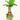 A vibrant, close-up view of the TocaCabana, featuring a textured green ceramic base topped with lush tropical leaves.
